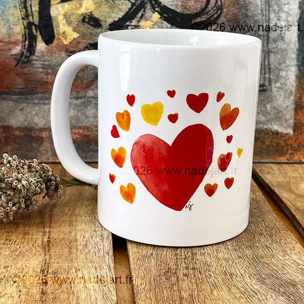 mug avec un chat roux d'un côté et des cœurs de l'autre